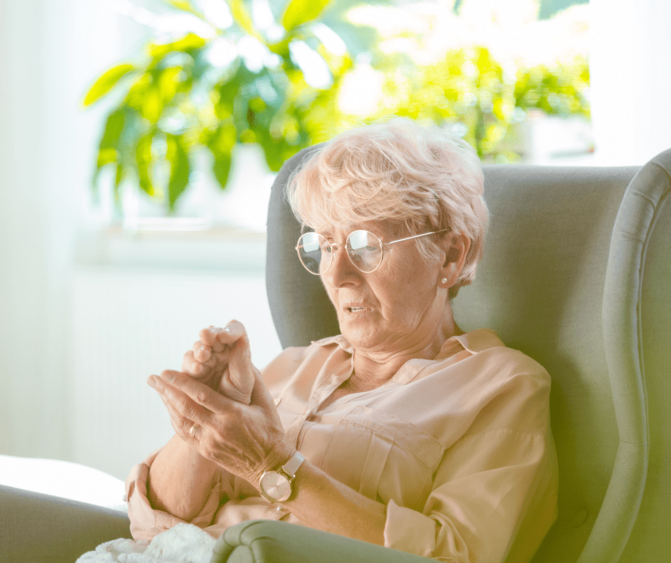 Elderly woman feeling numbness in hand